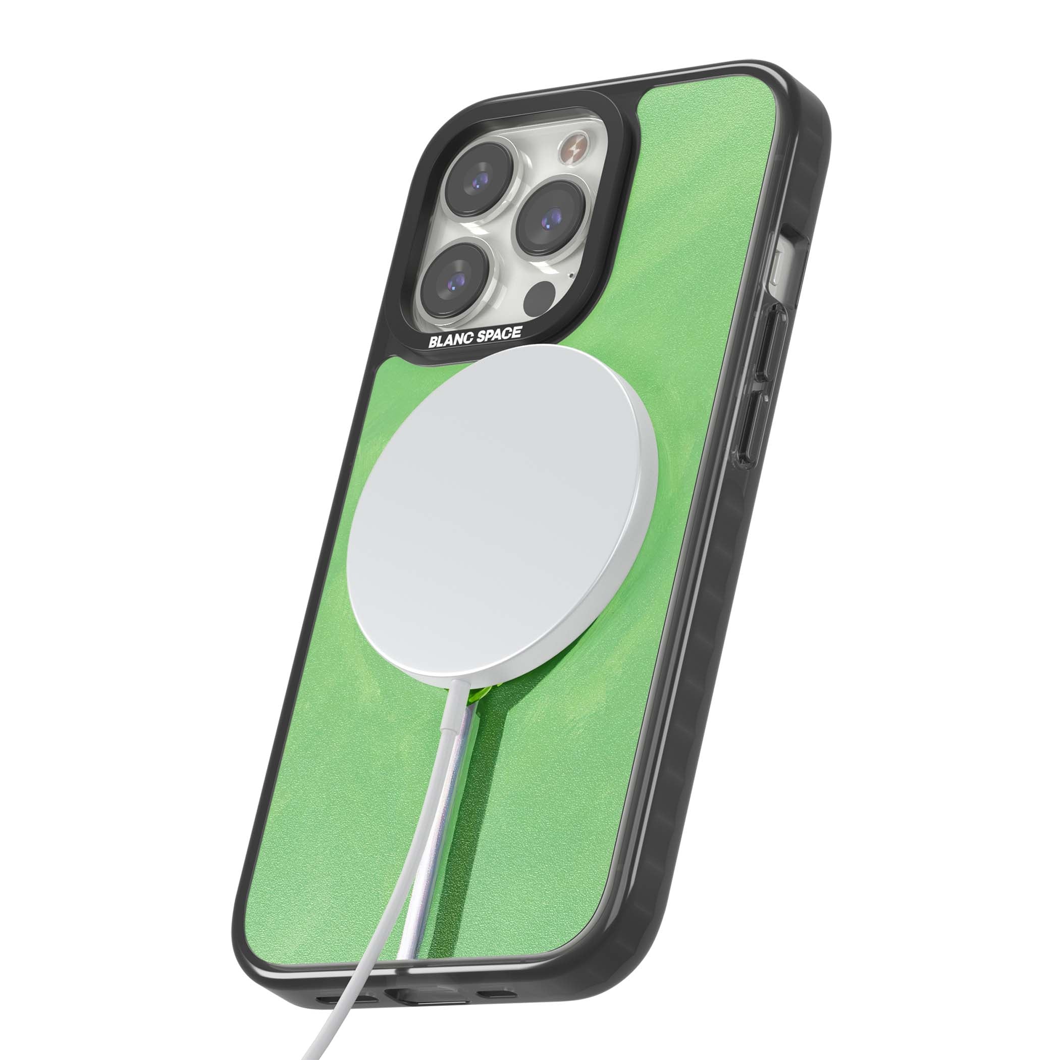 Green Lollipop candy art iPhone case featuring a glossy green heart-shaped lollipop on a painted pastel green background | Black Impact Magsafe case for iPhone 13 Pro, iPhone 14 Pro, iPhone 15 Pro