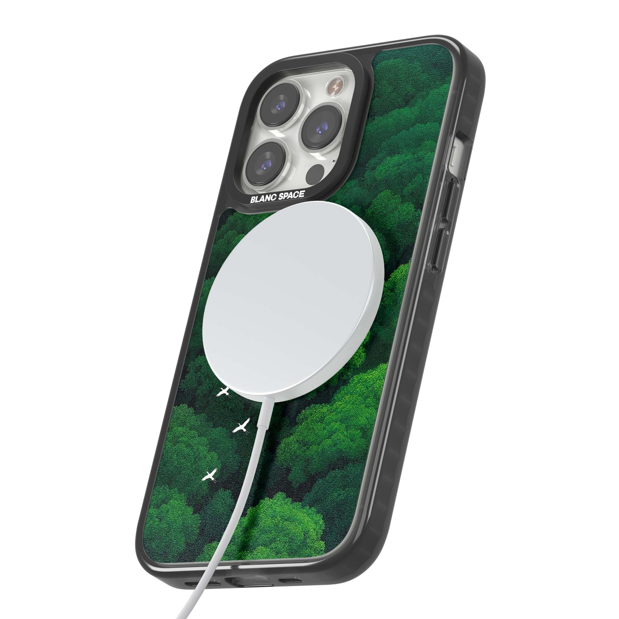 Grove Migration forest iPhone case featuring white cranes flying over lush green treetop canopy | Black Impact Magsafe case for iPhone 13 Pro, iPhone 14 Pro, iPhone 15 Pro