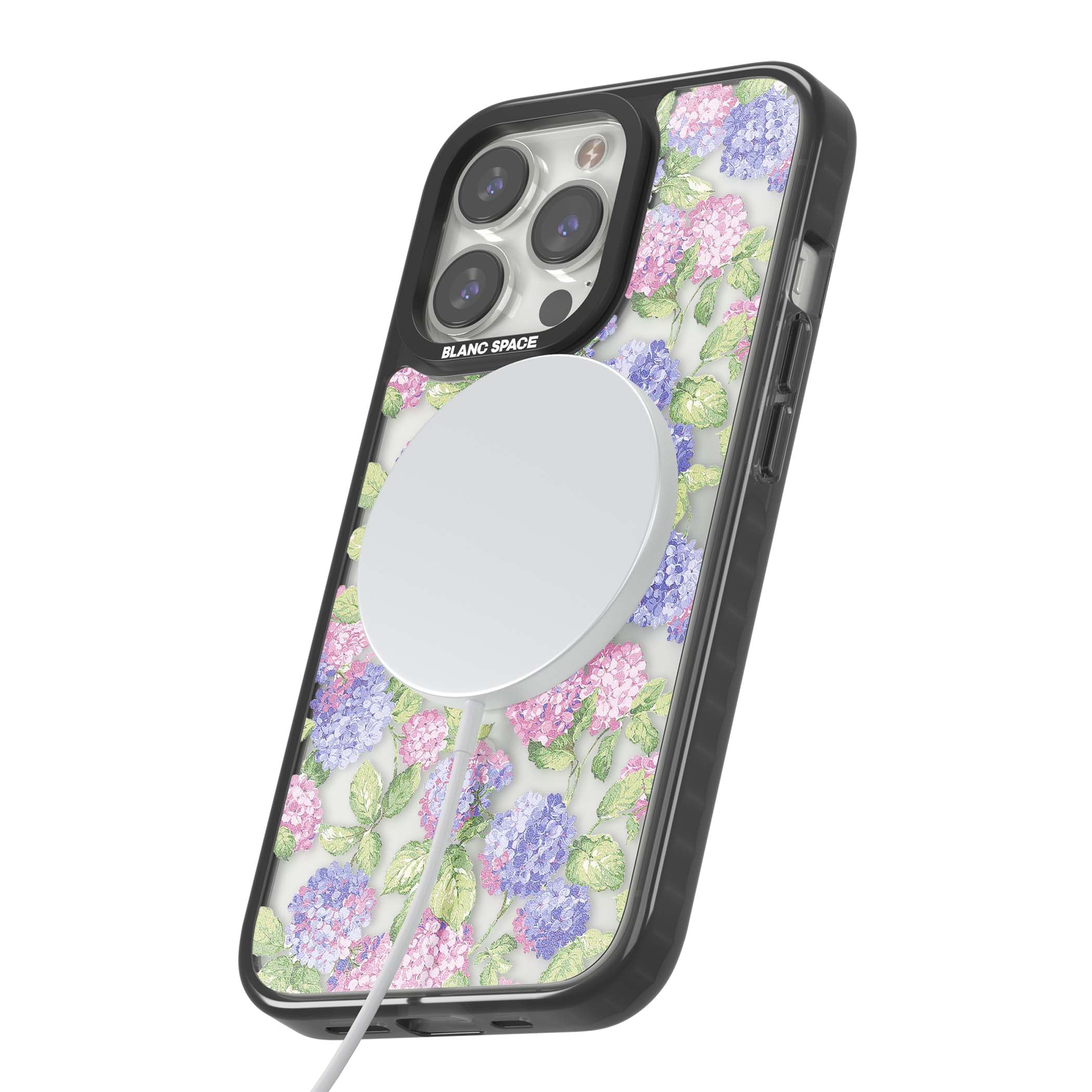 Cottage Hydrangea cottagecore iPhone case featuring pink and purple hydrangea blooms with green leaves on a clear background | Black Impact Magsafe case for iPhone 13 Pro, iPhone 14 Pro, iPhone 15 Pro