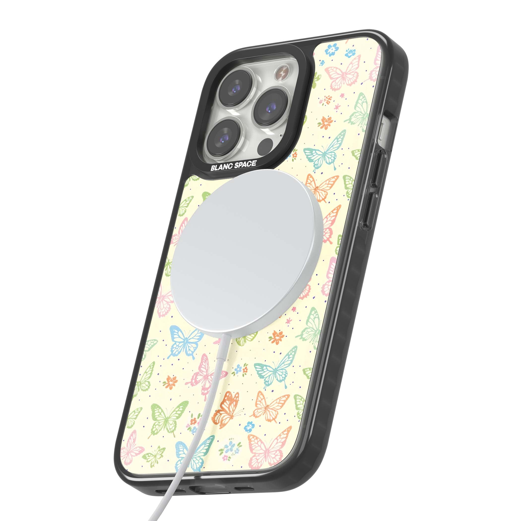 Sugar Wings cottagecore iPhone case featuring rainbow pastel butterflies, tiny wildflowers, and a cream background | Black Impact Magsafe case for iPhone 13 Pro, iPhone 14 Pro, iPhone 15 Pro